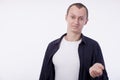 On a white background an ordinary young man in a white T-shirt, Royalty Free Stock Photo