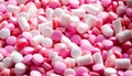 A White Background with pink and white Tablets And Pills In Different Shapes And Sizes Royalty Free Stock Photo