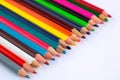 White background for presentation slide with colorful pencils wi