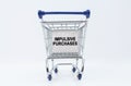 On a white background is a shopping cart with a sign that says - impulsive purchases