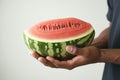 White background simplicity mens hands cradle a watermelon delight