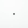 A white background with a small black dot in the center. The image is minimalist, Royalty Free Stock Photo