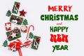 White background with small Christmas gift boxes decors and greetings Royalty Free Stock Photo