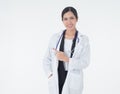 In the white background texture copyspace, the female doctor wears the uniform of the hospital and the clinic stands, pointing Royalty Free Stock Photo
