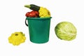On a white background there is a bucket of vegetables Royalty Free Stock Photo