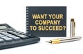 On a white background, there is a calculator and a black notebook with the inscription - WANT YOUR COMPANY TO SUCCEED