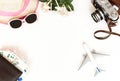 White background, Travel, airplane, camera, straw hat, purse with bank cards and money, top view.