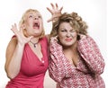 On a white background two adult women blonde scare Royalty Free Stock Photo