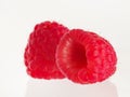 On a white background, two fragrant berries of ripe fresh raspberries. Superfood, dessert. Vitamins, antioxidants. Healthy