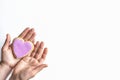 On white background woman`s hands hold gingerbread heart. space for text