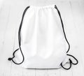 White backpack with black string