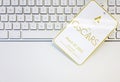 White badge with the Academy Awards Oscars logo and the date of the event on a computer keyboard Royalty Free Stock Photo