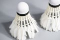 Two damage white badminton shuttlecocks lay on white table background Royalty Free Stock Photo