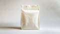 A white bag of coffee sitting on top of a table Royalty Free Stock Photo