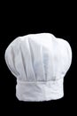 A white baker's toque on a black background Royalty Free Stock Photo