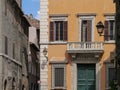 White balcony in old street in Rome, Italy Royalty Free Stock Photo