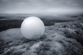 White ball in a landscape