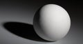 White ball with shadow on gray background Royalty Free Stock Photo