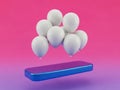 White balloons floating above a blue object on a pink background Royalty Free Stock Photo
