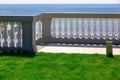 White balustrades with gray railings and a marble walkway.