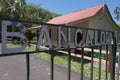 White Bangalow inscription on a weathered iron gate