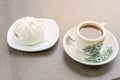 White bao buns with kopitiam coffee mug with saucer in traditional Chinese breakfast Royalty Free Stock Photo