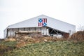 White Barn with Patriotic Quilt and a Semi Trailer Royalty Free Stock Photo