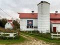 White barn with red white and blue quilt Royalty Free Stock Photo