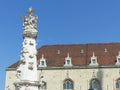 White baroque column with statues of saints in the district Buda of Budapest in Hungary.