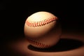 White baseball on dark background