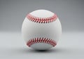 White baseball with red stitching. The Royalty Free Stock Photo