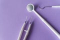 Set of dental instruments on colorful background