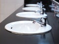 White basin at public toilet