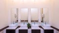 white basins in bathroom interior with granitic tiles