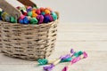 Basket with colored threads of floss on white wooden background. Royalty Free Stock Photo