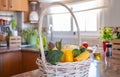 White basket with fresh vegetables, in the kitchen. Healthy eating concept and detox diet. Vegan and vegetarian food Royalty Free Stock Photo