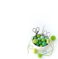White basket with green knitting yarn. Royalty Free Stock Photo