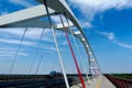 white basket-handle arch design steel cable suspension bridge.