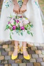 White basket in the hands of the bride. Royalty Free Stock Photo