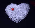 white bath salt heart with a small red heart on it Royalty Free Stock Photo