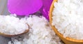 White bath salt in a wooden bowl with a spoon and an orchid Royalty Free Stock Photo