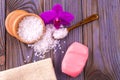 White bath salt in a wooden cup with a spoon on a wooden table w Royalty Free Stock Photo