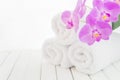 White bath towels and orchid flower Royalty Free Stock Photo