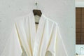 White bathrobe on a hanger Royalty Free Stock Photo