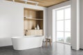 White bathroom corner with tub and cabinet Royalty Free Stock Photo