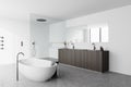 White bathroom corner with tub, shower and sink Royalty Free Stock Photo