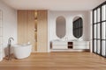 White bathroom interior with tub, double sink and closet Royalty Free Stock Photo