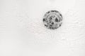 White bathroom sink drain close up Royalty Free Stock Photo