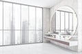 White bathroom with windows and two sinks Royalty Free Stock Photo