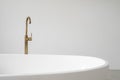 White bathtub with copper faucet in contemporary interior design Royalty Free Stock Photo